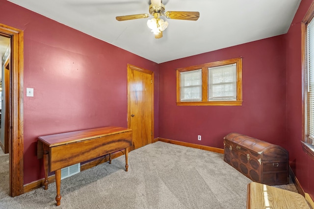 misc room featuring ceiling fan, carpet flooring, and baseboards