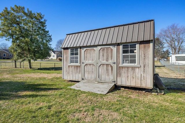 view of shed with a fenced backyard