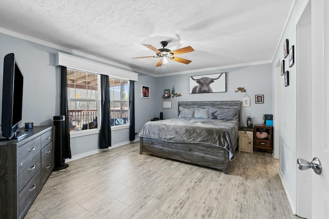 bedroom with crown molding, light wood finished floors, ceiling fan, a textured ceiling, and baseboards