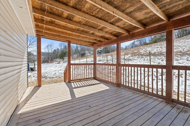 view of snow covered deck