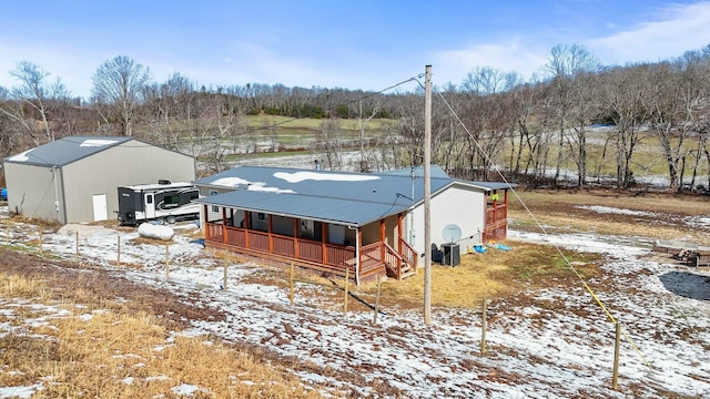 exterior space with covered porch and metal roof