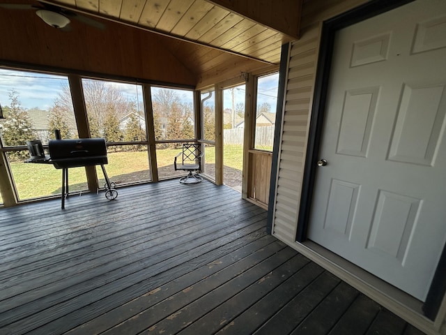 unfurnished sunroom with lofted ceiling and wood ceiling