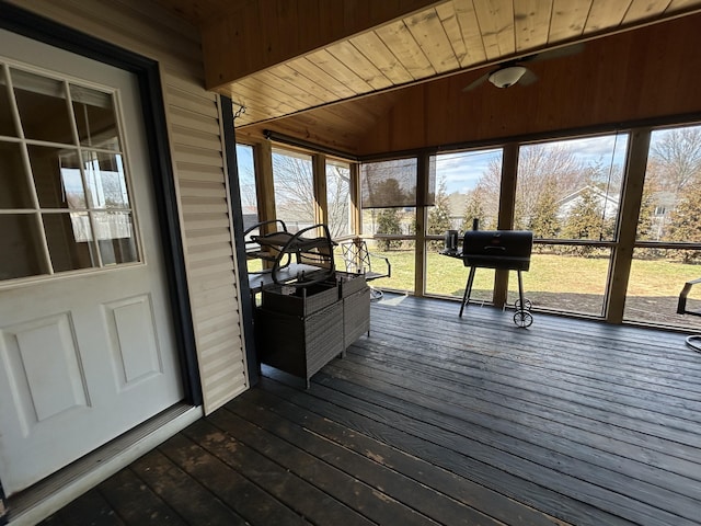 sunroom / solarium featuring lofted ceiling and wooden ceiling