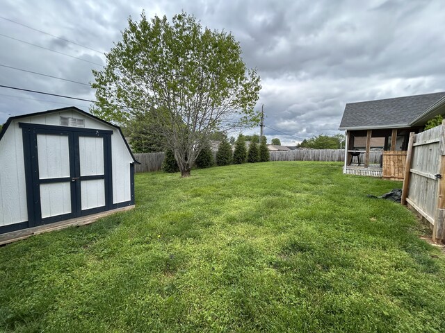 1692 Patterson Branch Rd, Somerset, KY 42503 - view of yard with an outdoor structure, a shed, and a fenced backyard