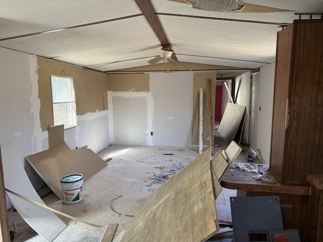 interior space with lofted ceiling and ceiling fan