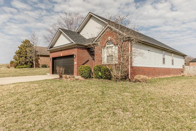 view of property exterior featuring a garage, driveway, brick siding, and a yard