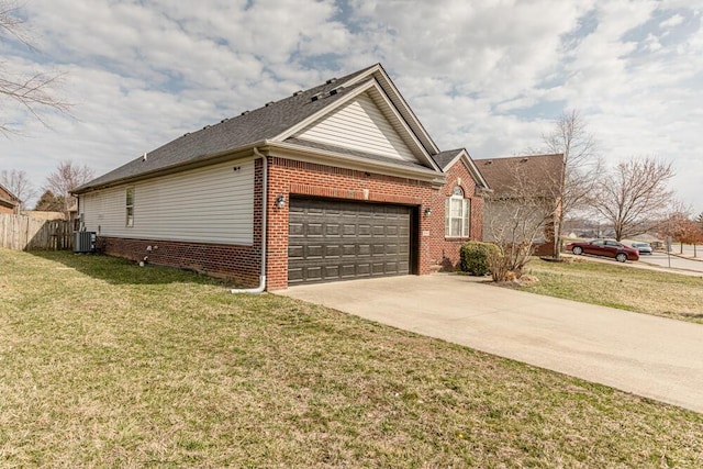 view of side of property featuring brick siding, central AC unit, driveway, a yard, and an attached garage