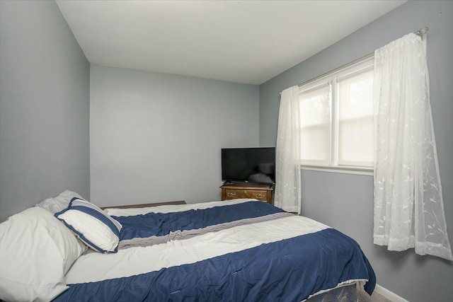 bedroom with carpet floors and baseboards