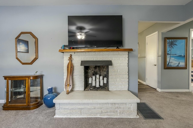 room details with carpet, a fireplace, visible vents, and baseboards