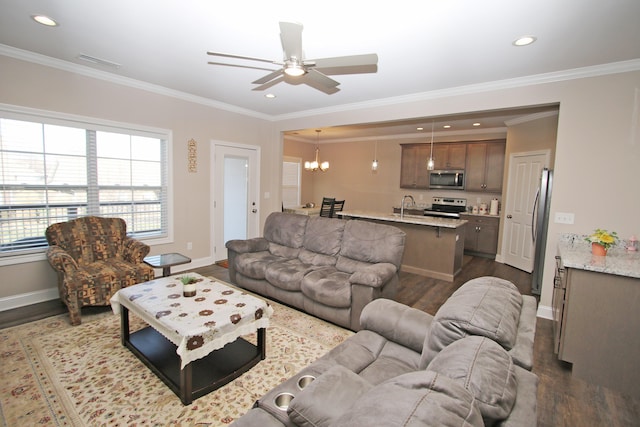 living room featuring crown molding and dark wood finished floors