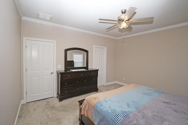 bedroom featuring light carpet, visible vents, a ceiling fan, baseboards, and ornamental molding