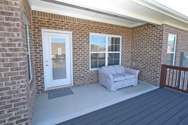 wooden deck with a patio area