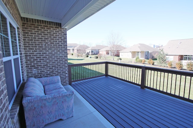 view of wooden balcony featuring a residential view, outdoor lounge area, and a wooden deck