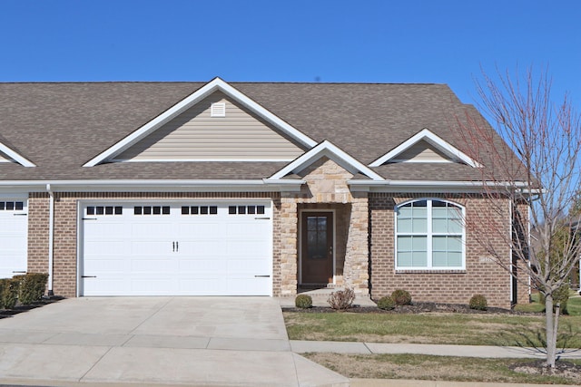 view of front of property featuring a garage, roof with shingles, driveway, and brick siding