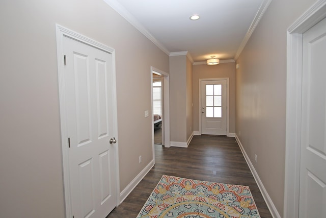 doorway to outside with ornamental molding, dark wood-type flooring, recessed lighting, and baseboards