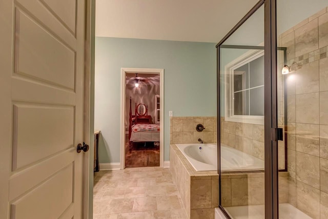 bathroom featuring a stall shower, ensuite bathroom, and a bath