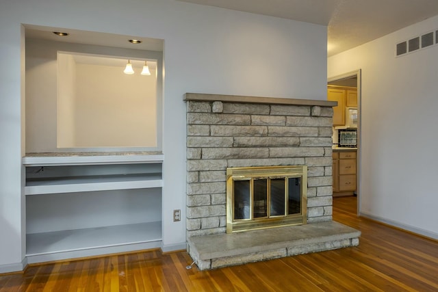 details with visible vents, baseboards, and wood finished floors