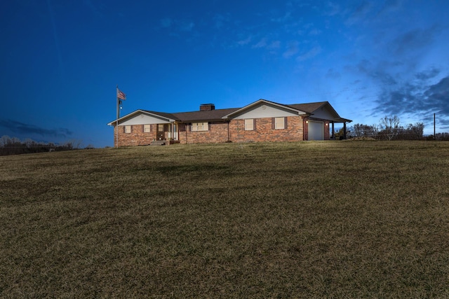 single story home featuring an attached garage, a chimney, and a front yard