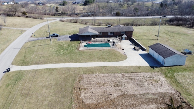 birds eye view of property with a rural view