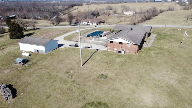 birds eye view of property with a rural view