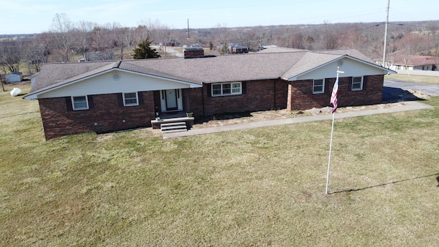 ranch-style house with brick siding and a front lawn