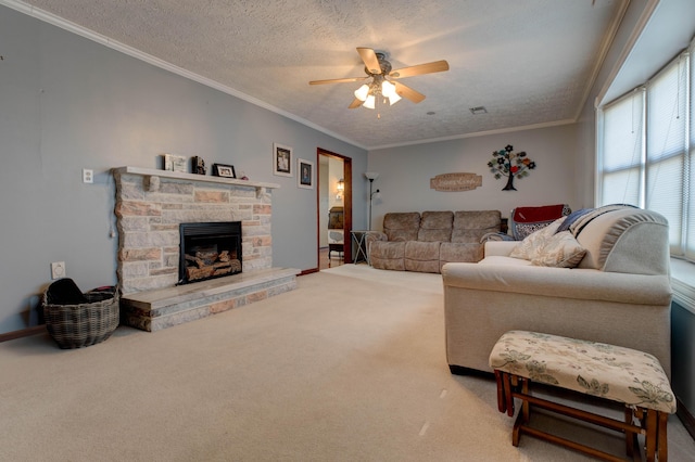 carpeted living room with ceiling fan, ornamental molding, a textured ceiling, and a stone fireplace