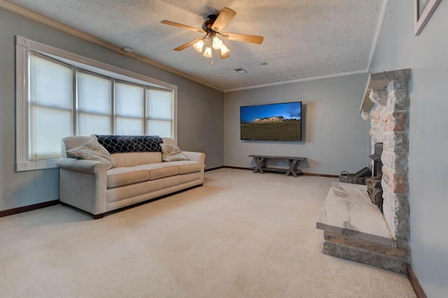 living area featuring baseboards, carpet, a textured ceiling, crown molding, and a fireplace