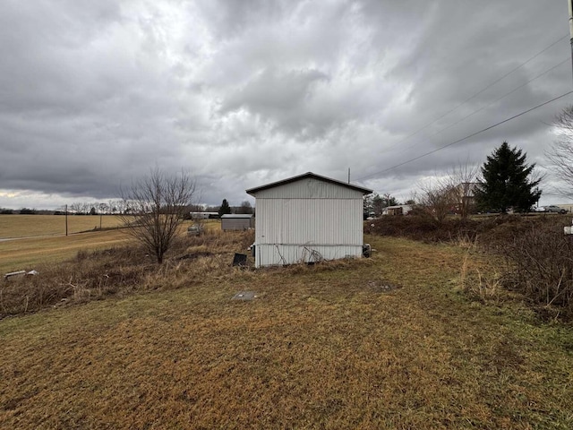 view of outbuilding featuring a rural view