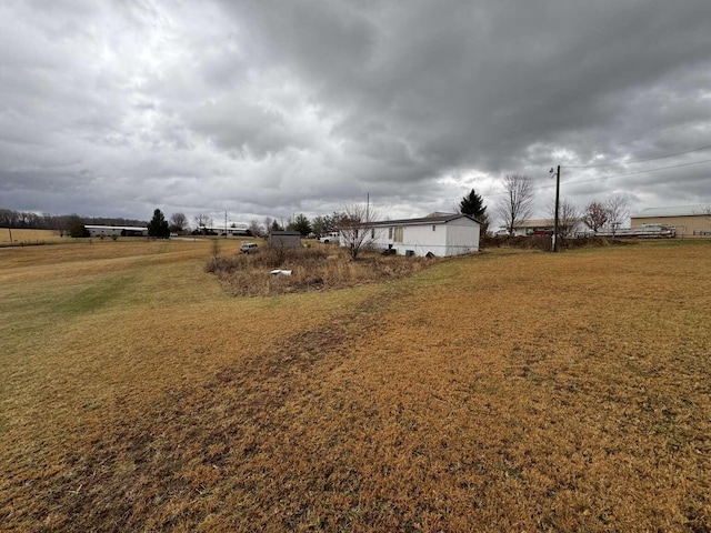 view of yard with a rural view