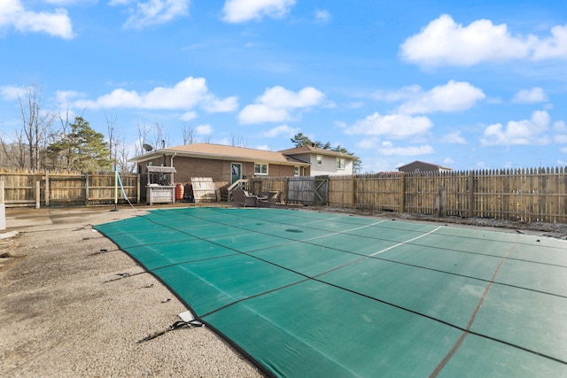 view of swimming pool with a fenced backyard and a fenced in pool