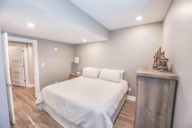 bedroom with recessed lighting, baseboards, and light wood finished floors