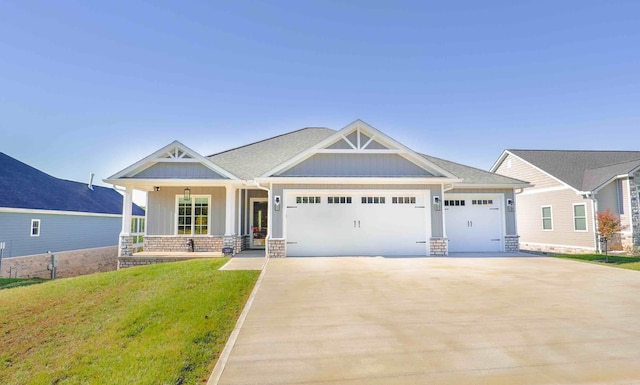 craftsman-style house with concrete driveway, a porch, an attached garage, a front lawn, and board and batten siding