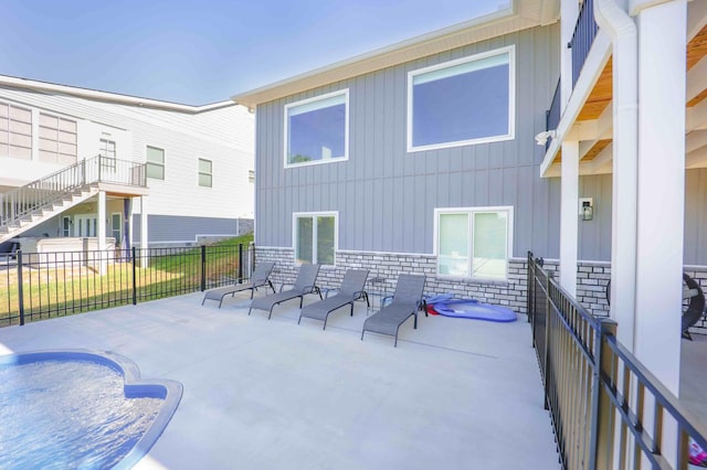 view of patio / terrace with stairs and fence