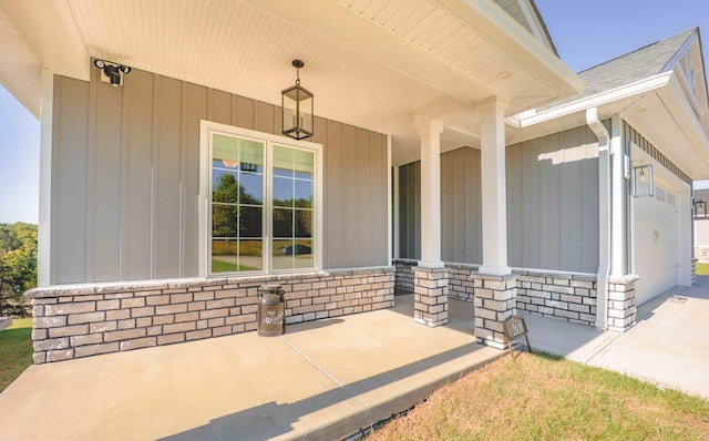 entrance to property featuring stone siding and roof with shingles