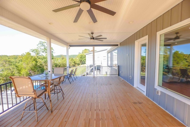 deck with a ceiling fan and outdoor dining space