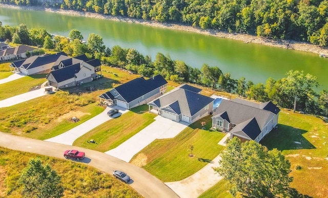 drone / aerial view featuring a residential view and a water view