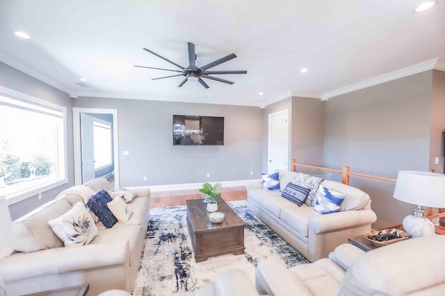 living area with baseboards, recessed lighting, wood finished floors, and crown molding