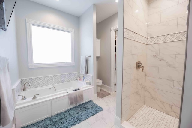 full bath featuring toilet, a garden tub, a shower stall, and marble finish floor