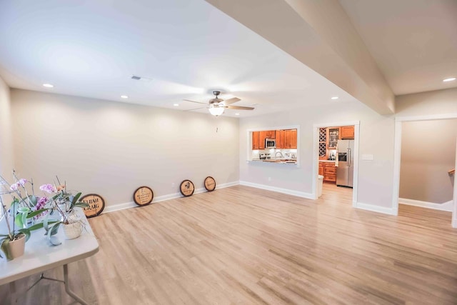 interior space with visible vents, baseboards, a ceiling fan, light wood-style flooring, and recessed lighting