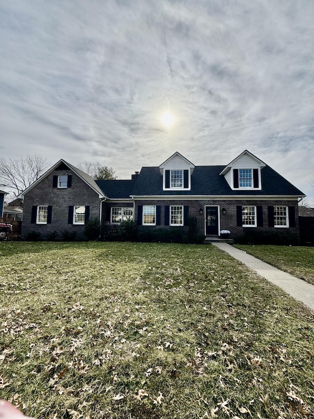 view of front facade featuring a front lawn and brick siding