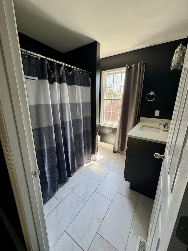 bathroom featuring vanity, visible vents, toilet, marble finish floor, and a shower with shower curtain