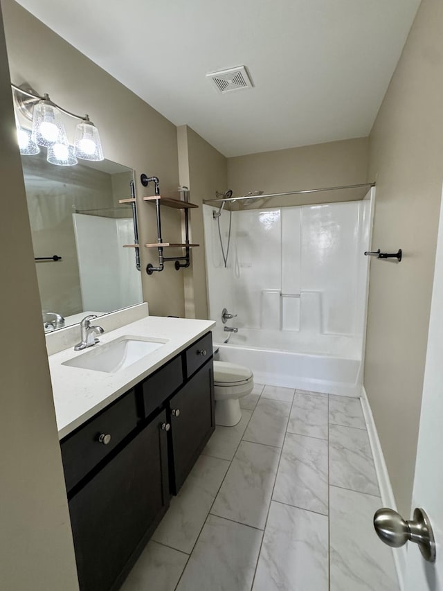 full bath featuring marble finish floor, visible vents, toilet, washtub / shower combination, and vanity