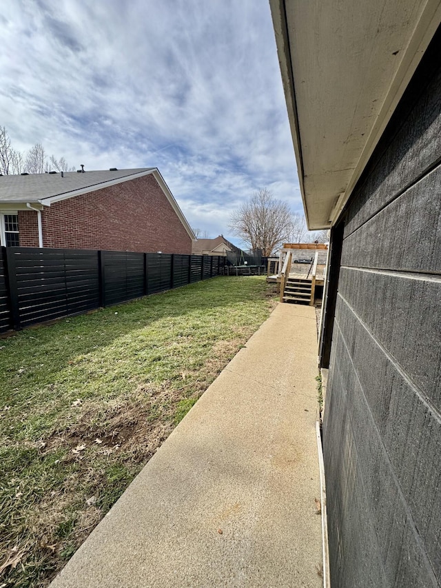 view of yard with a fenced backyard