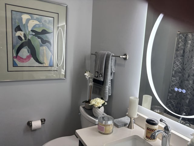 bathroom with toilet and vanity