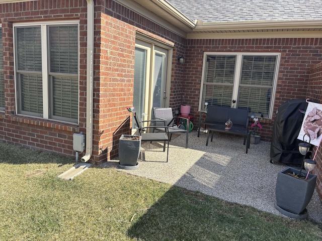 view of patio featuring a grill