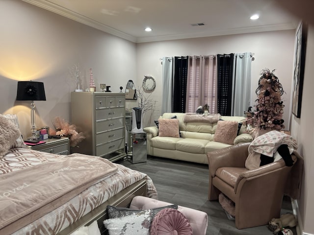 bedroom featuring visible vents, ornamental molding, wood finished floors, and recessed lighting