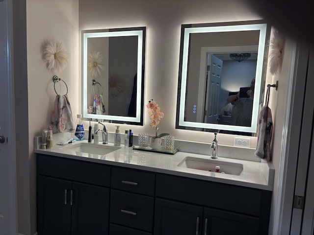 full bath with a sink and double vanity