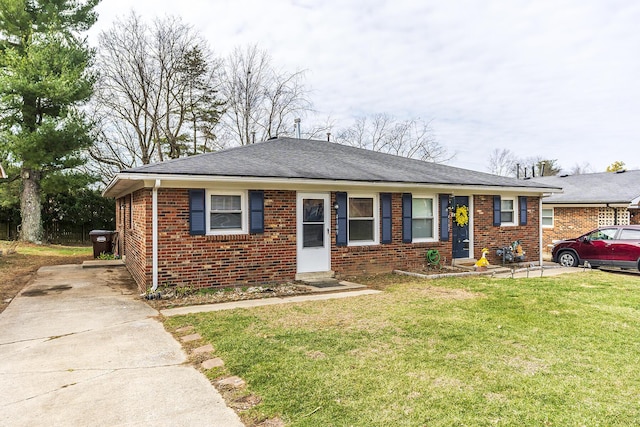 ranch-style house featuring brick siding, a front lawn, and a shingled roof