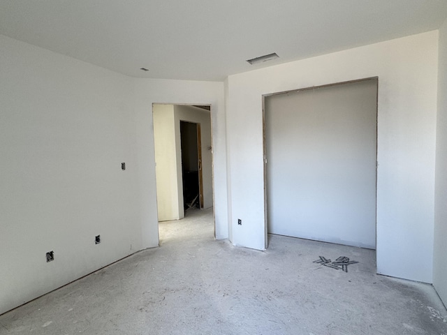 unfurnished bedroom with visible vents