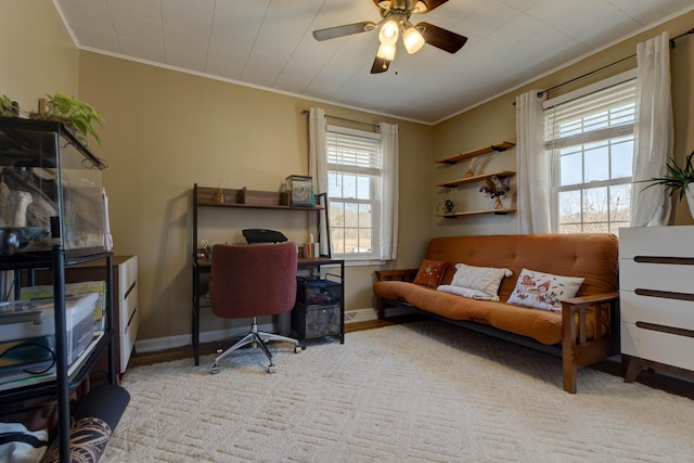 home office with baseboards, ornamental molding, ceiling fan, and wood finished floors